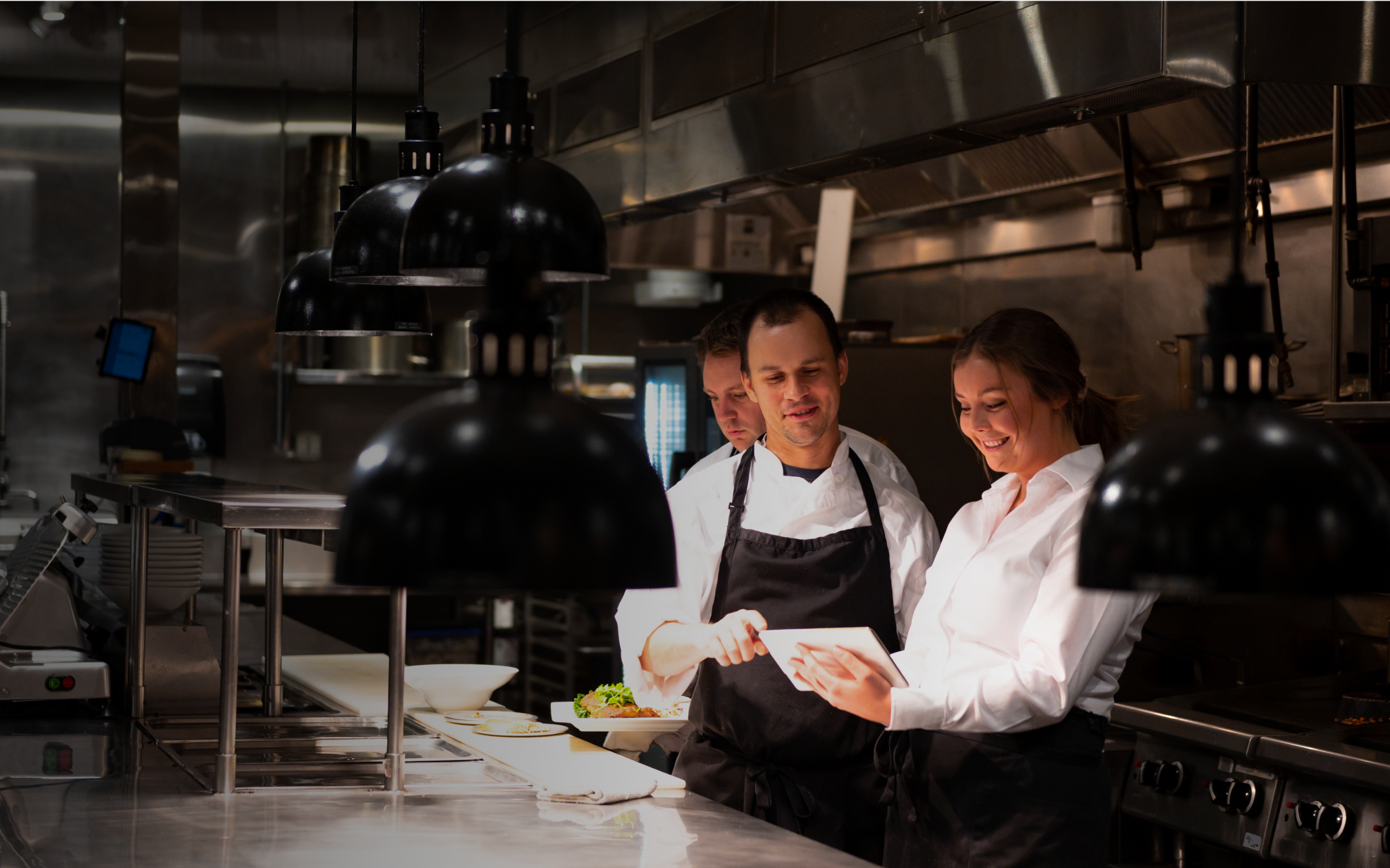 Chefs working together in a kitchen.